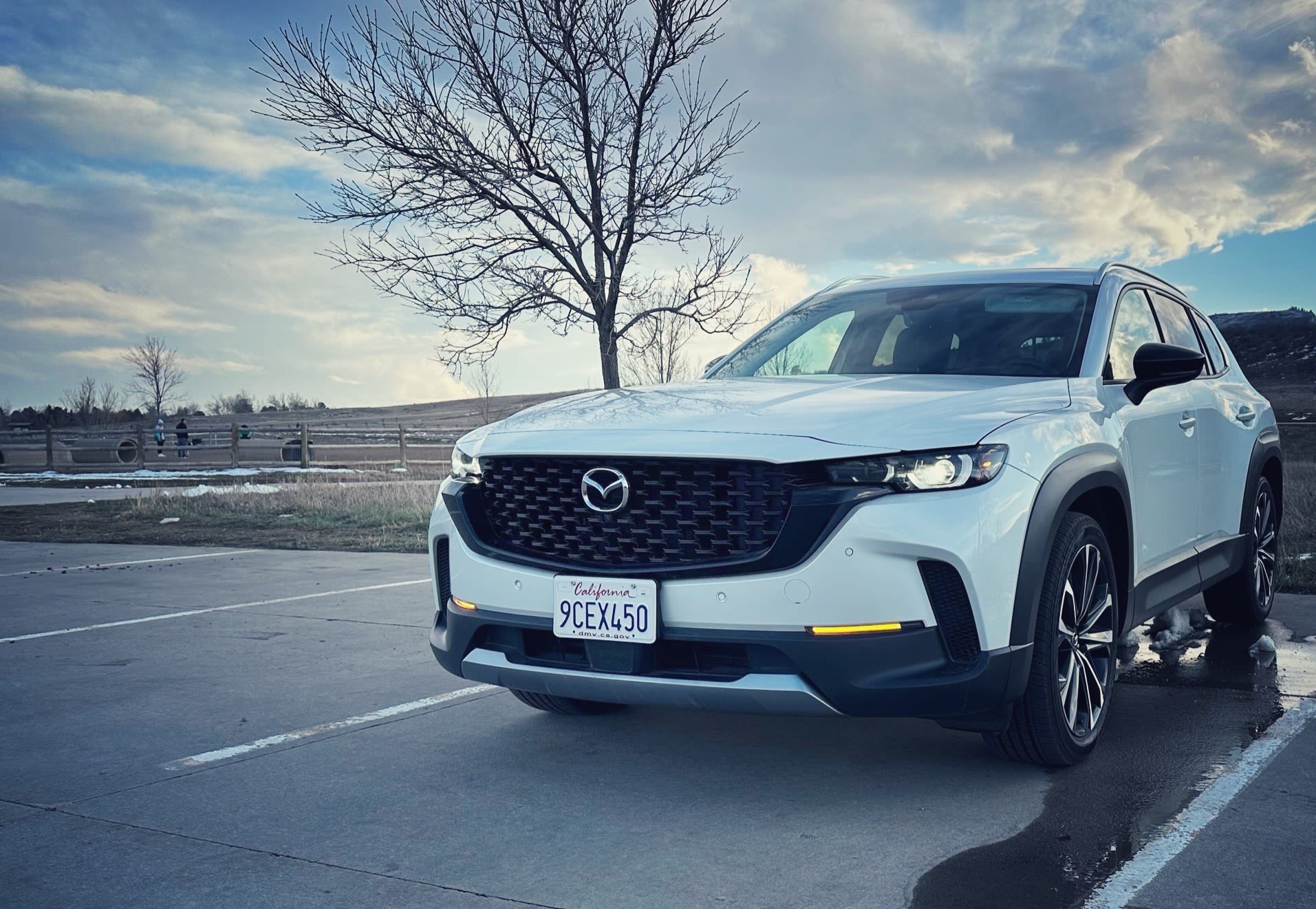 exterior of a while 2023 Mazda CX-50 in a parking lot