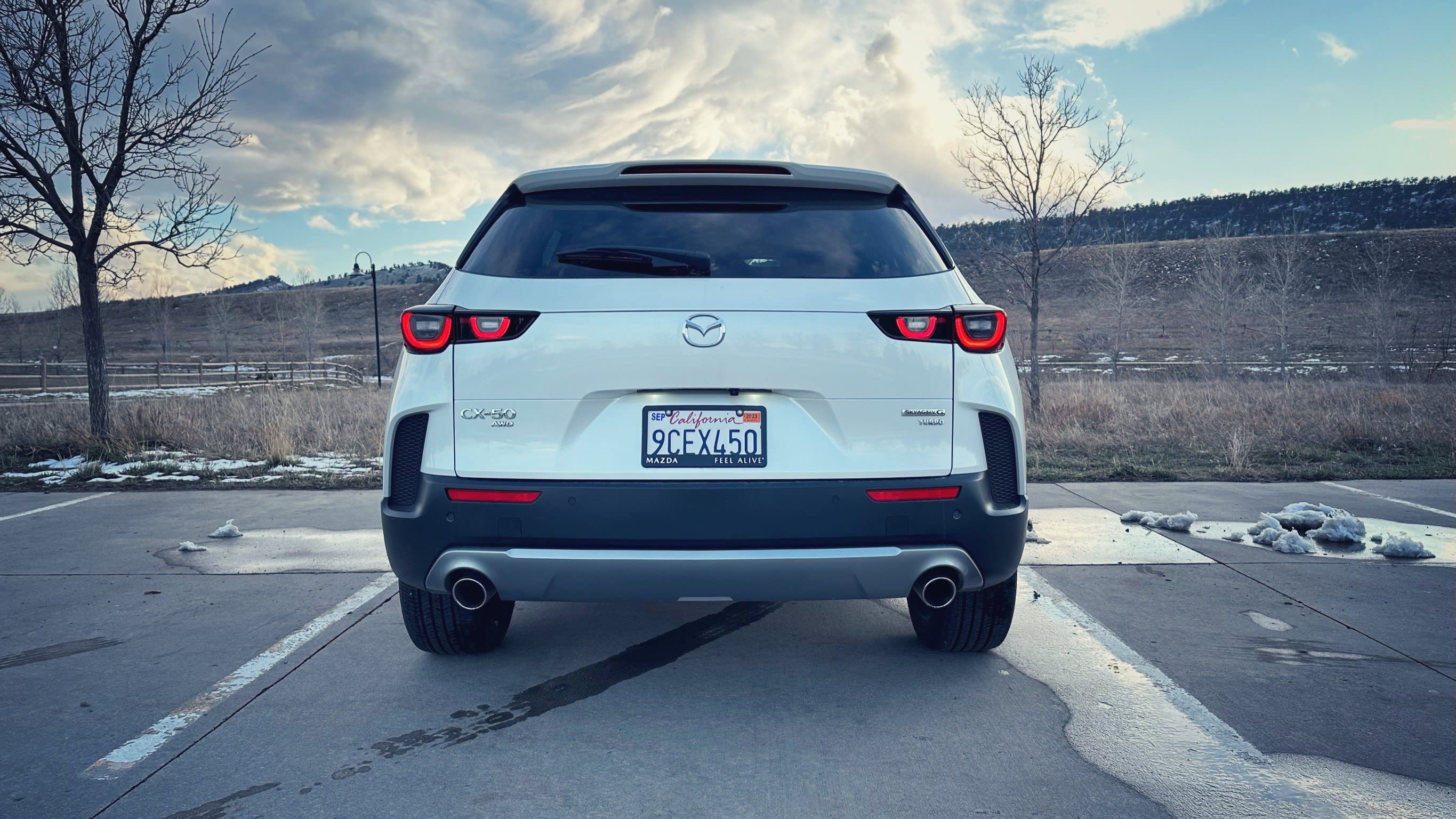 image of a white 2023 Mazda CX-50 as seen from the rear