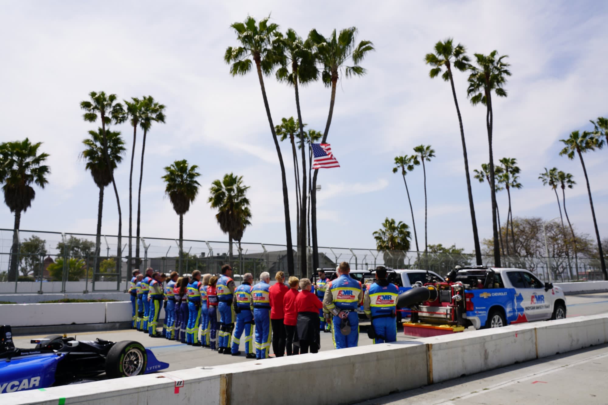 image of the American flag and a racing team at the IndyCar races in Long Beach