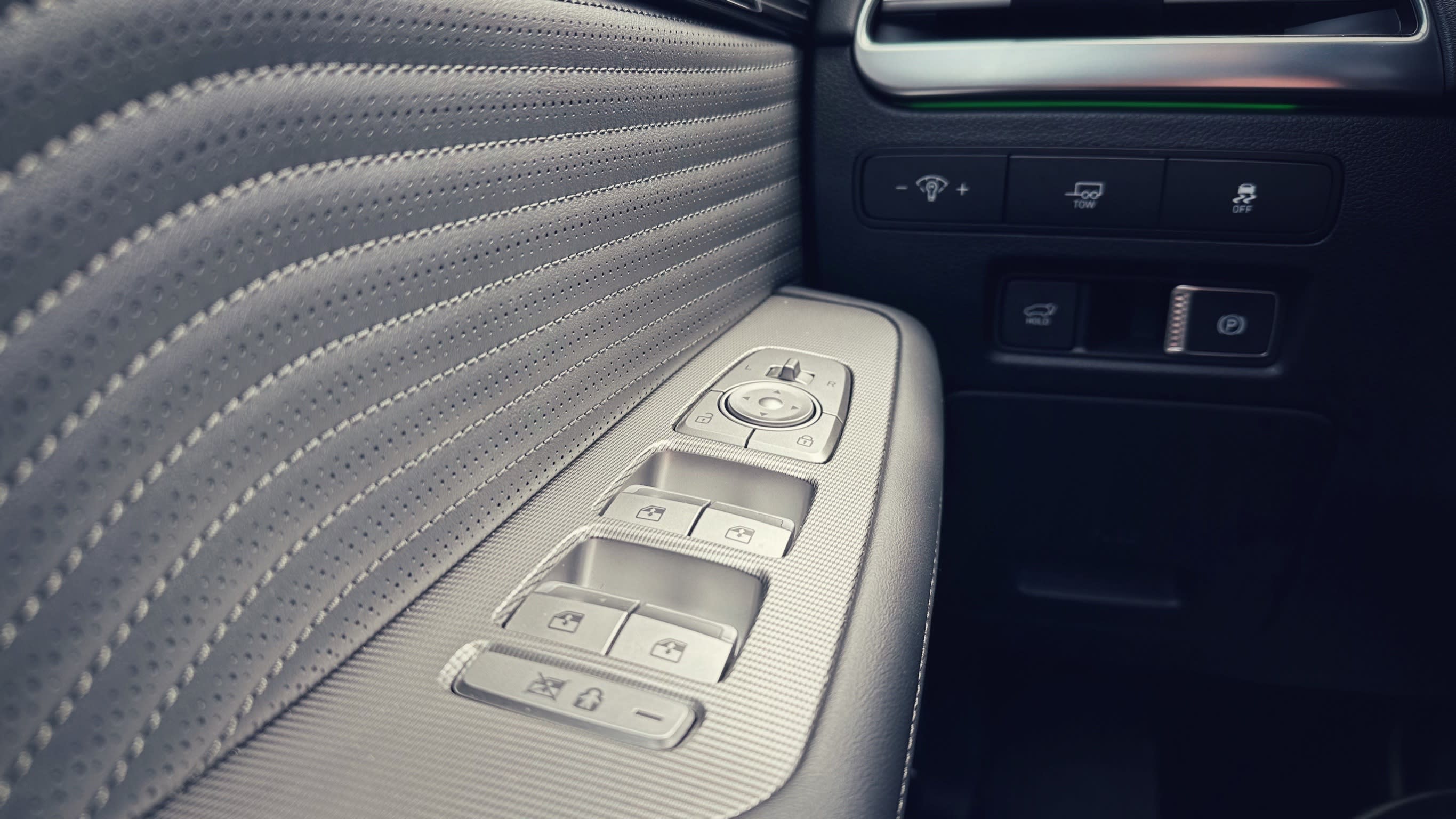 interior view of the 2023 Hyundai Palisade Calligraphy, showing a closeup of the inside of the driver's door