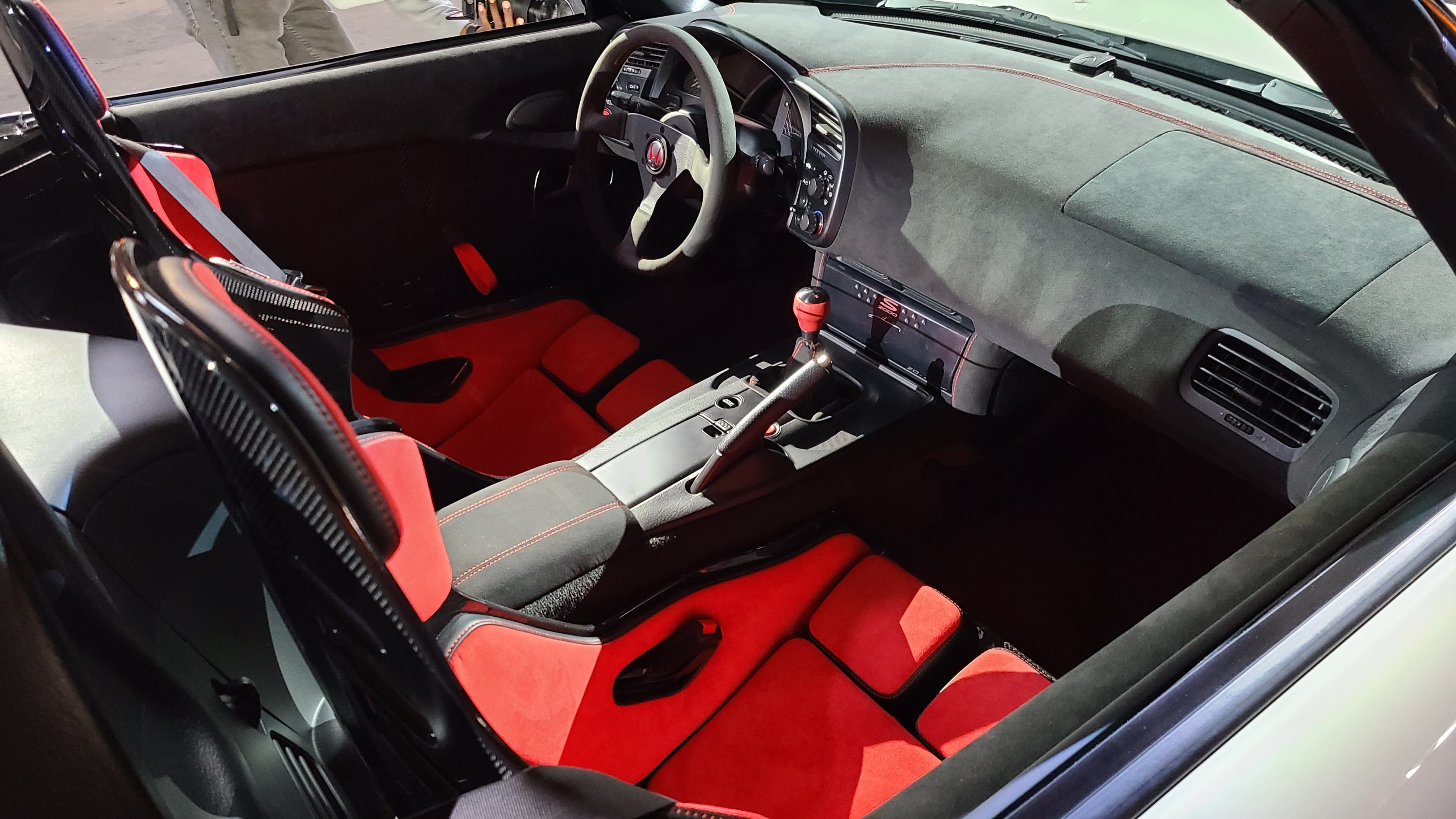 red interior of a white S2000 Type R on display at the event