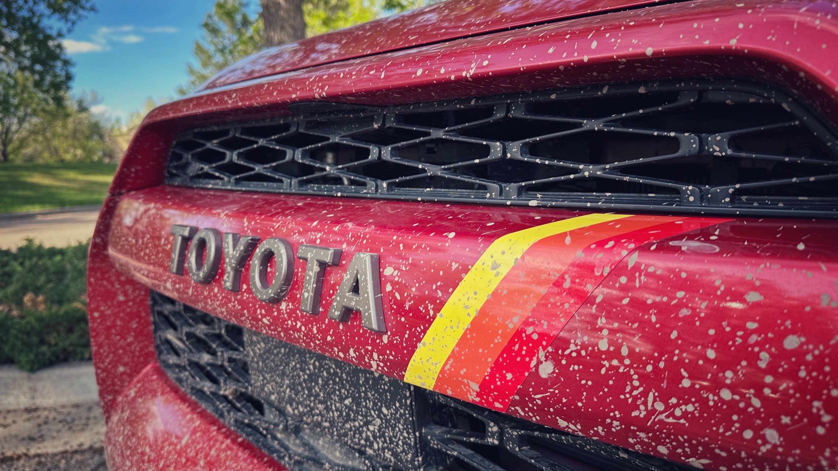 closeup of the grille of a 40th Anniversary Edition 4Runner featuring the yellow, orange, and red stripes