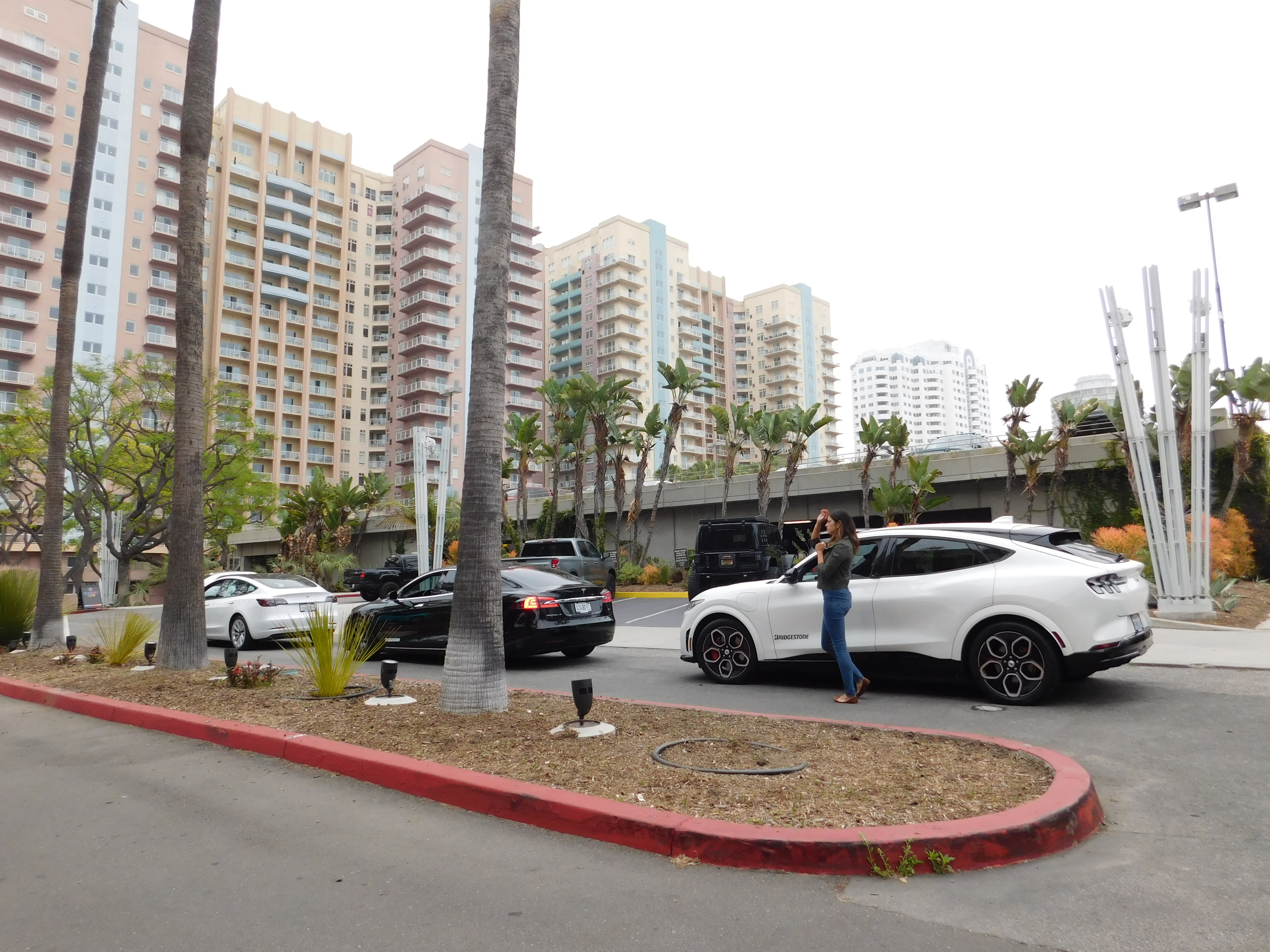 a row of Tesla vehicles ready for testing the Bridgestone tires