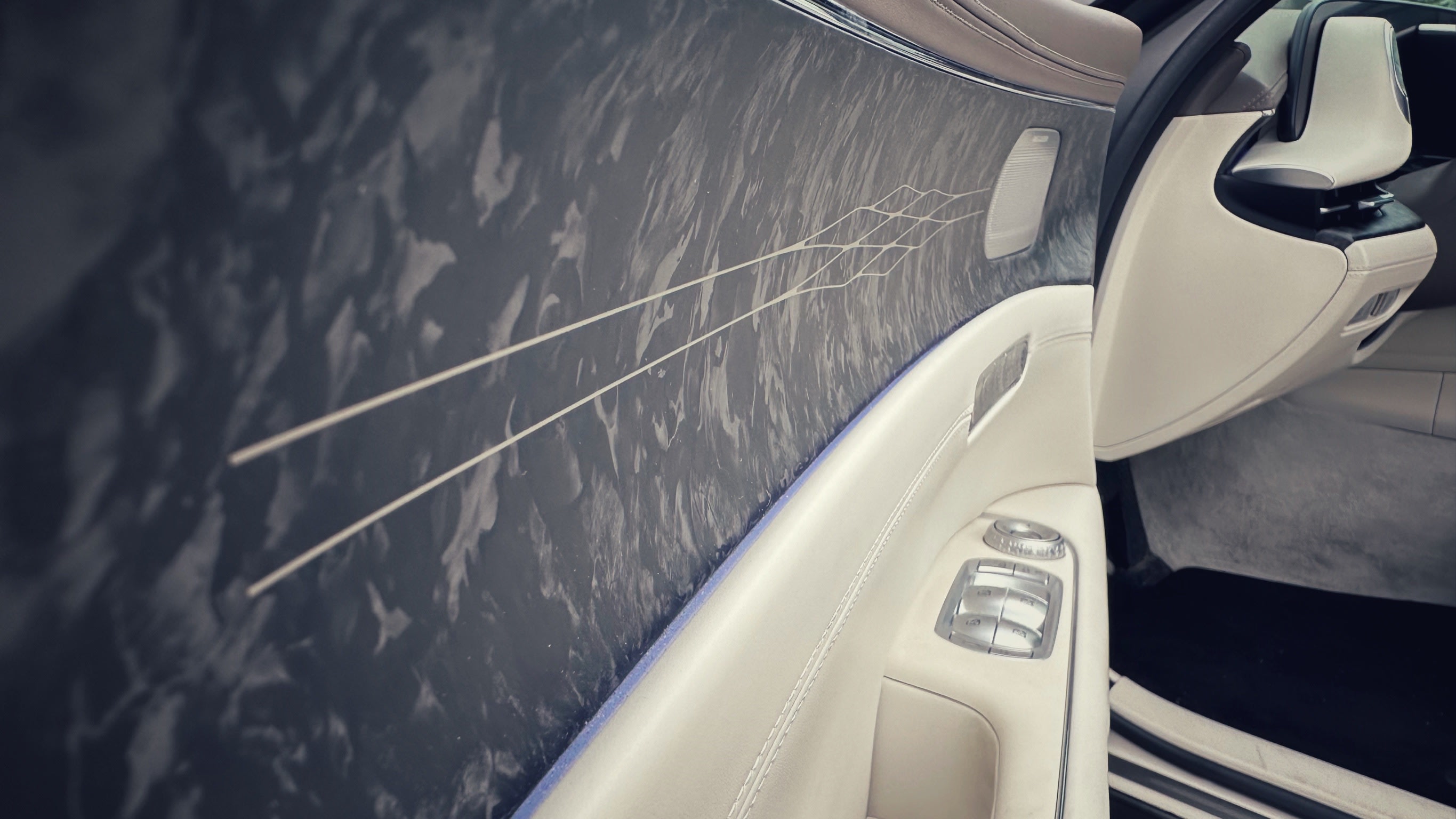 interior view of the Genesis G90 featuring the snazzy inlays of the door