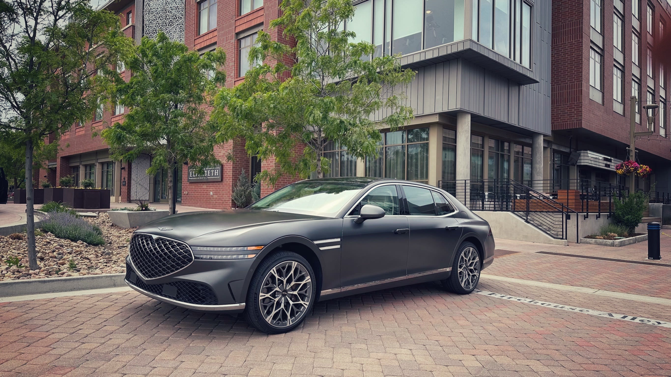 An image of the exterior of a matte gray Genesis G90