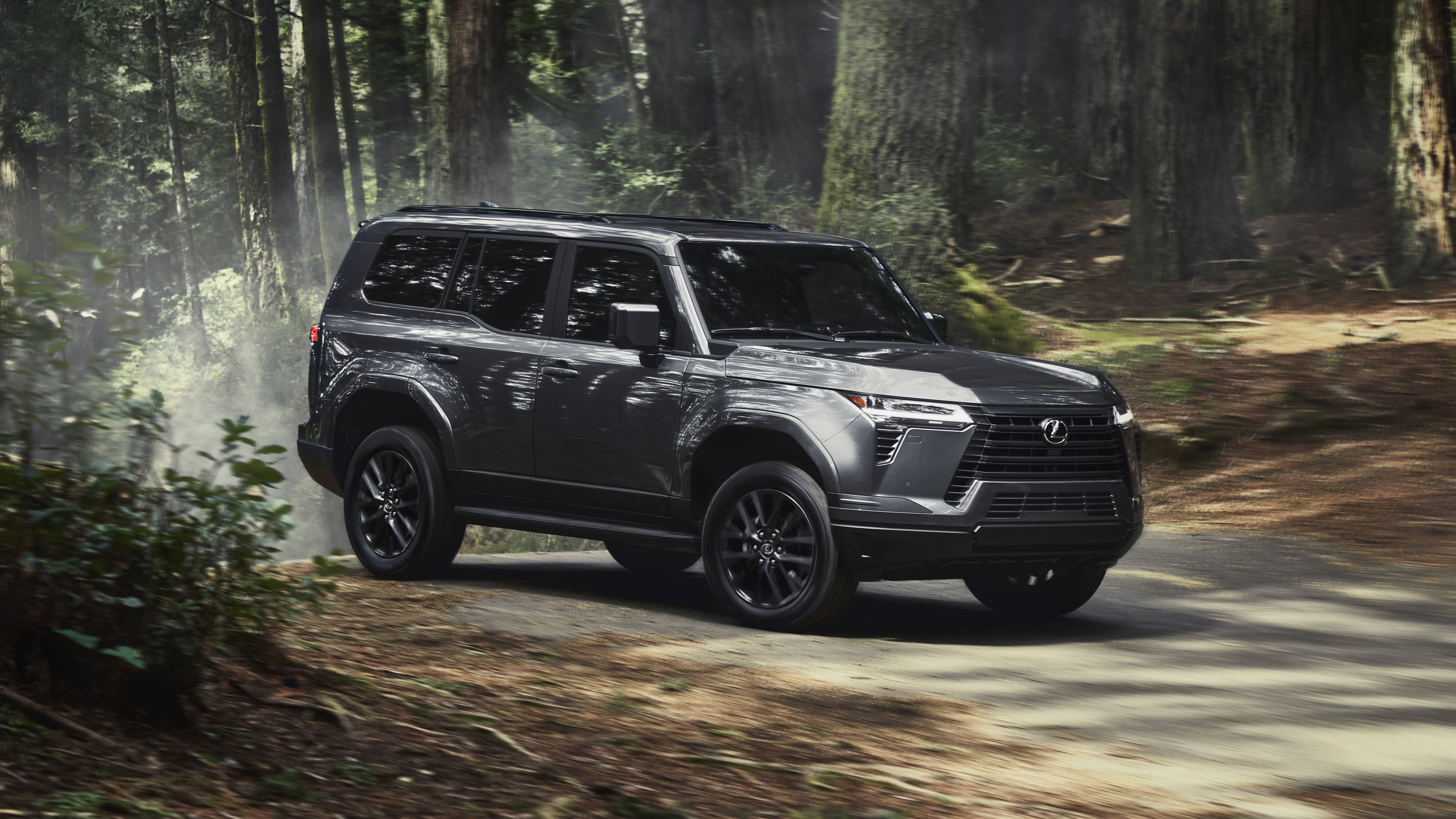 Lexus GX driving down country road