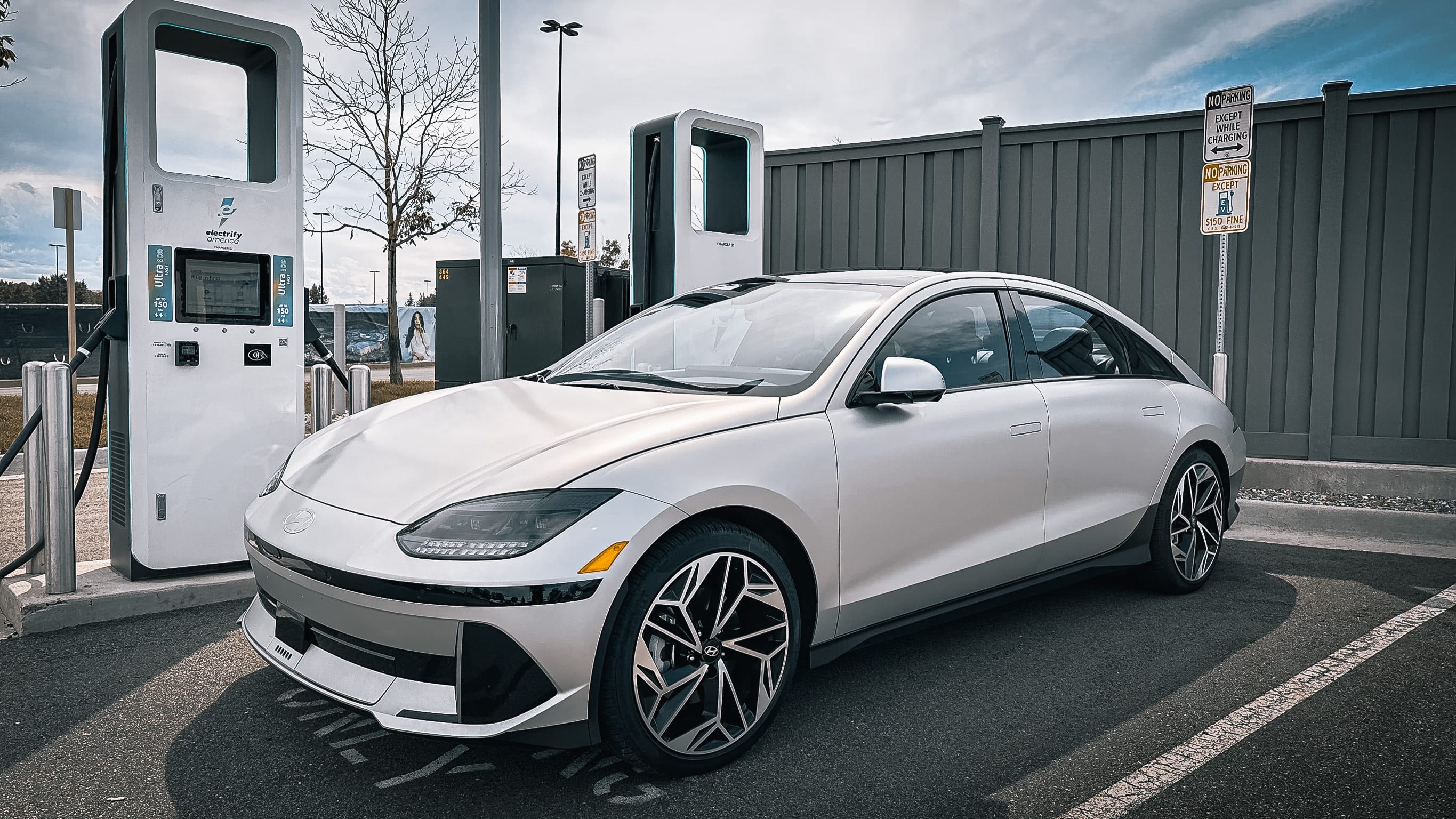 a matte gray Hyundai Ioniq 6 parked at an EV charging station