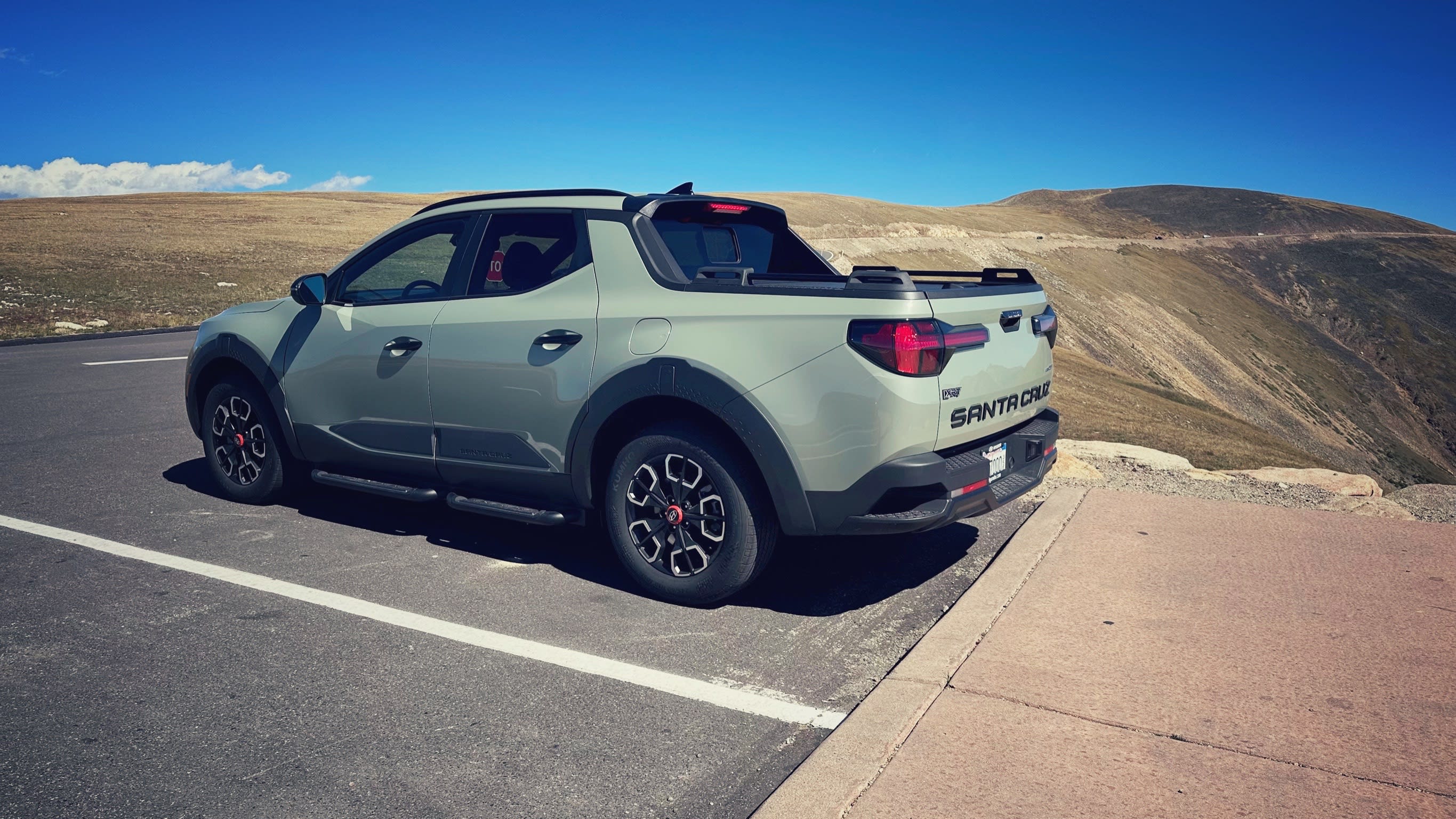 a dark green 2024 Hyundai Santa Cruz at a rest stop in Rocky Mountain National Park