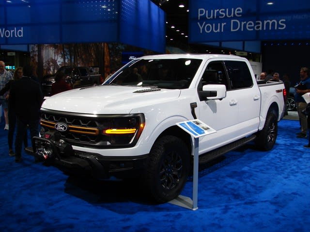 a white Ford F-150 on display at the 2023 NAIAS