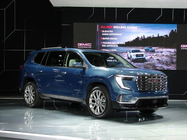 a blue GMC Acadia on display at the 2023 NAIAS