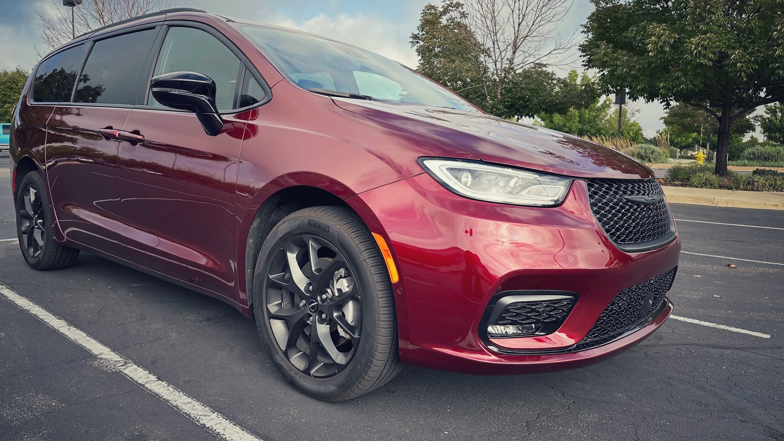 front and side view of a red 2023 Chrysler Pacifica