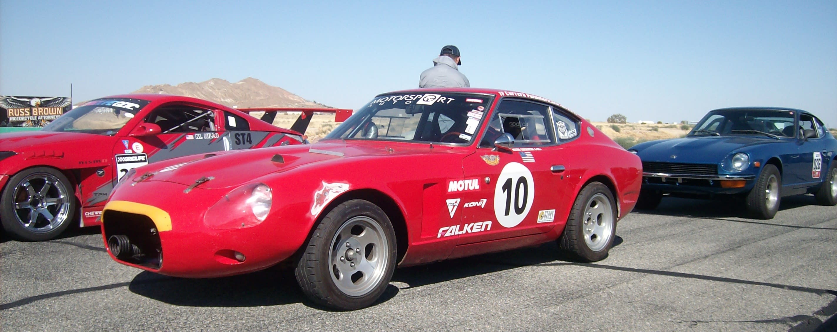 a red Datsun ready for racing