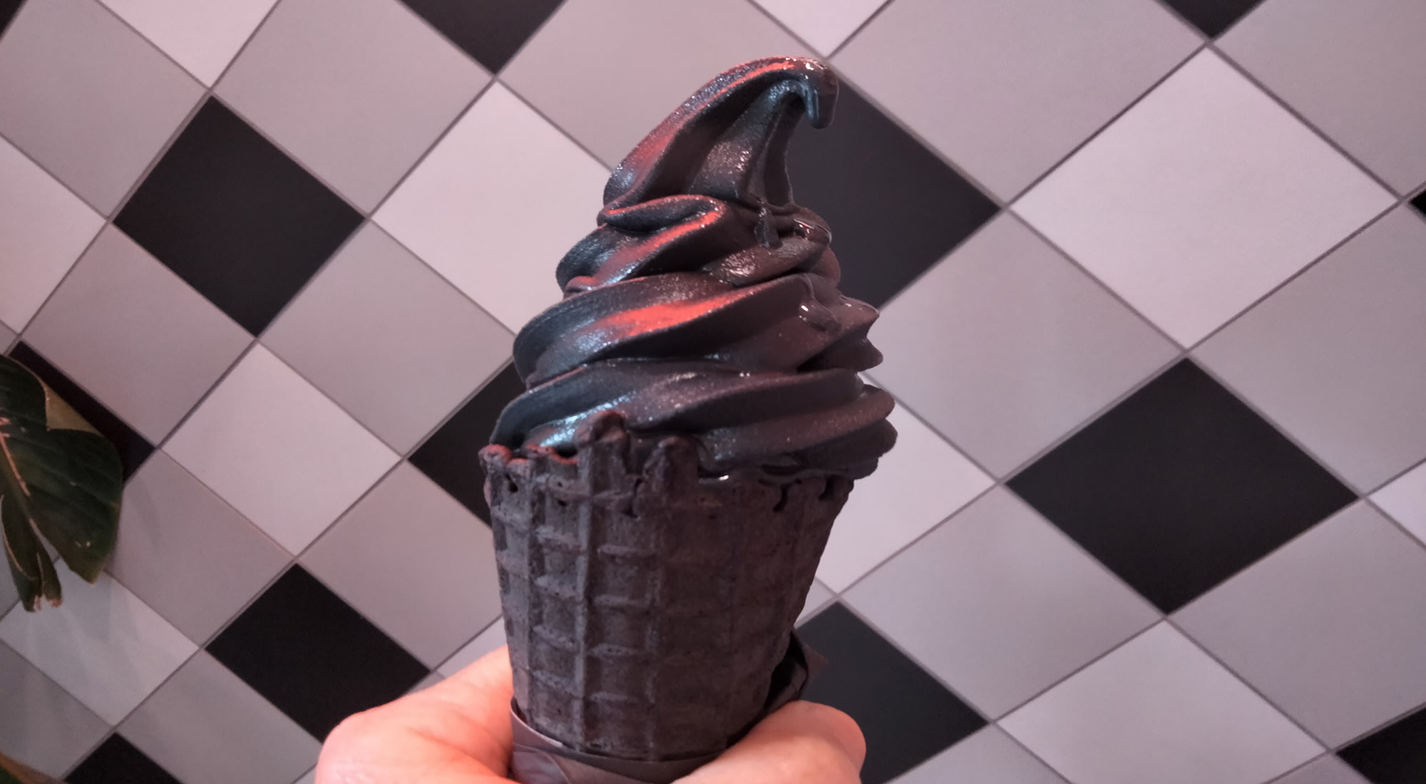 black ice cream in black cone