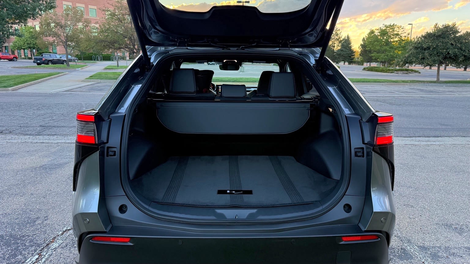 2026 Toyota bZ with liftgate open, cargo floor visible and rear seatbacks upright.