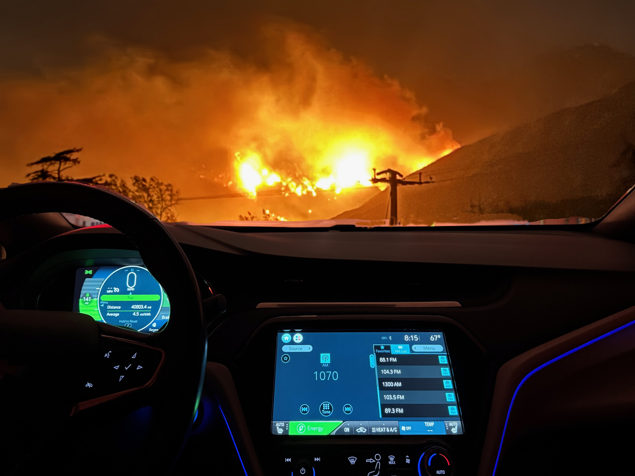 Bolt EV dashboard tuned to AM radio, plus Eaton Fire