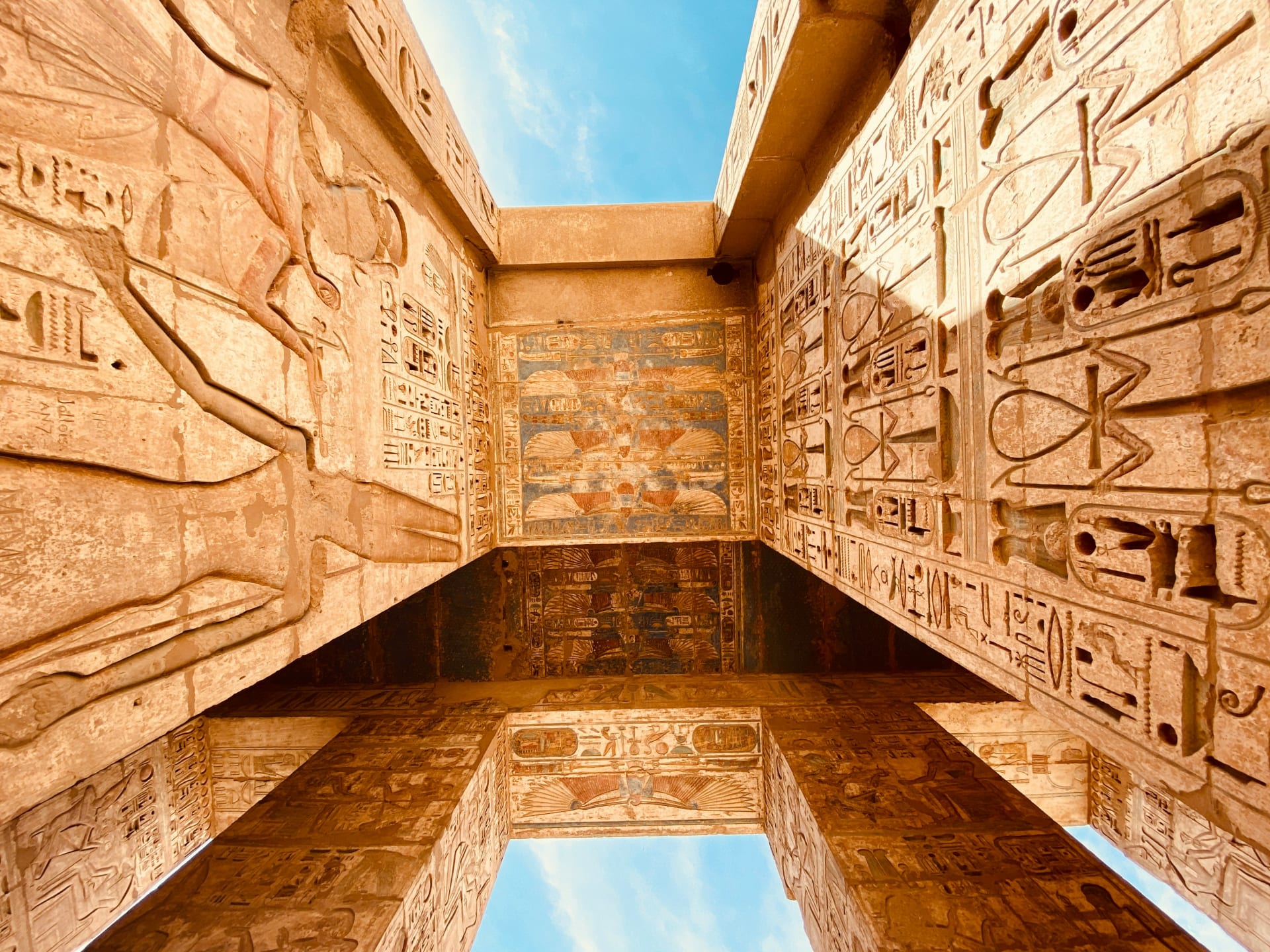 Carved columns and hieroglyphs at an ancient Egyptian temple