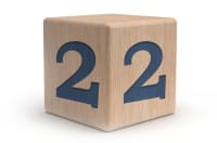 Wooden block with numeral two.