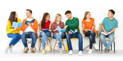 Group of adults sitting in chairs having a healthy book discussion