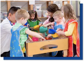 Preschool children engaged with adults learning about a variety of topics incorporating phonemic awareness practice