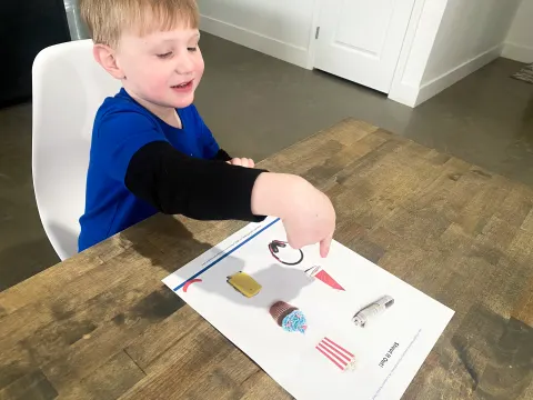 Young child pointing to the correct answer from the phonemic awareness activity