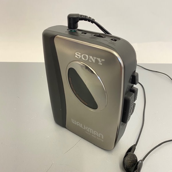 3: Silver Sony Walkman With In-Ear Headphones