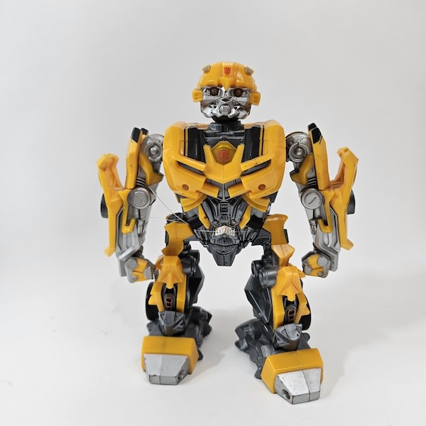 1: Yellow 80's Toy Robot