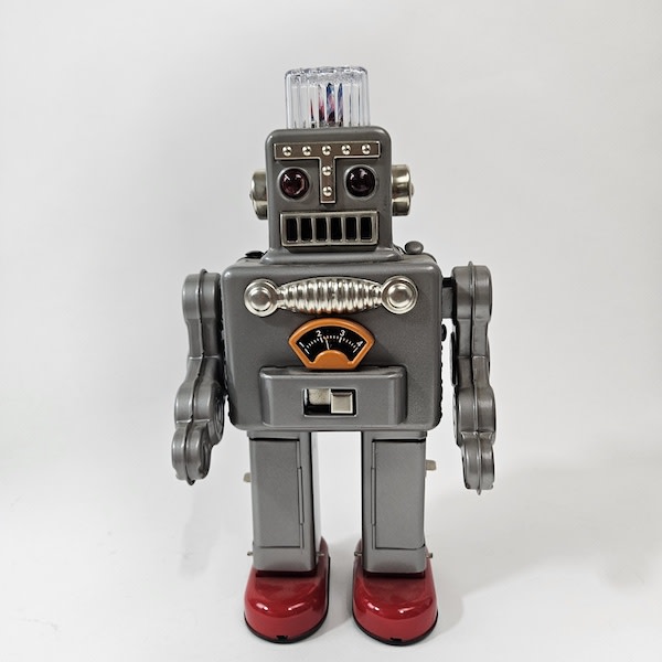 1: Retro Silver Toy Walking Robot