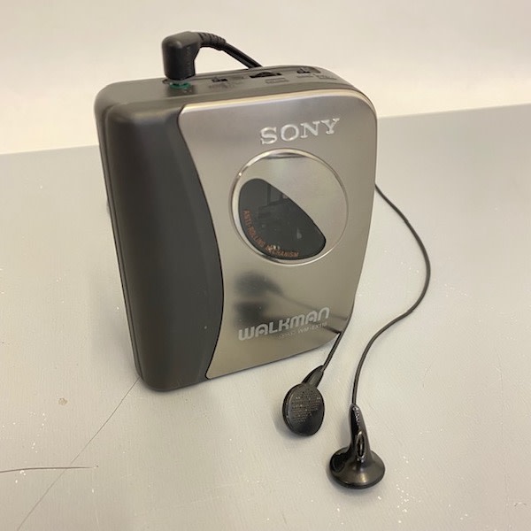 1: Silver Sony Walkman With In-Ear Headphones