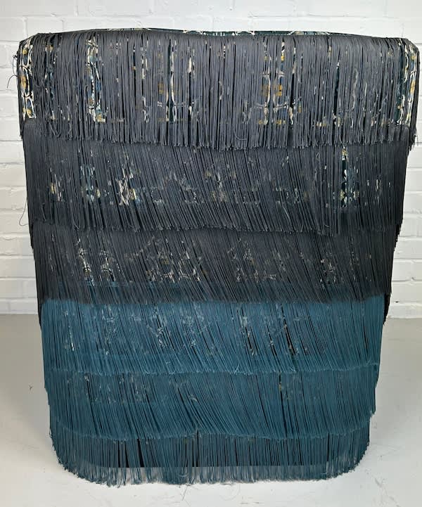 7: Stylish Fringed Chair