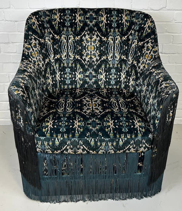 7: Stylish Fringed Chair
