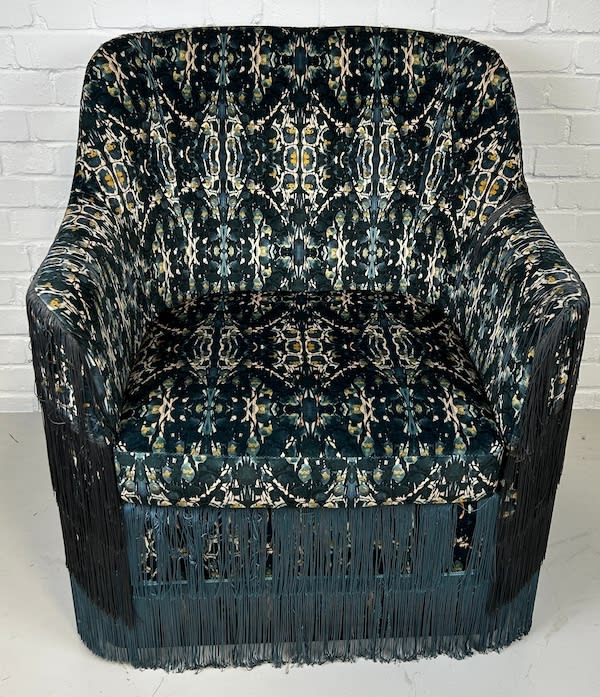 7: Stylish Fringed Chair