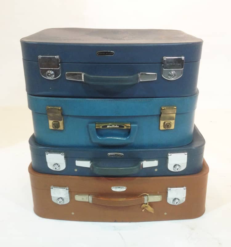 Stack of Different Coloured Retro Soft Leather Suitcases 