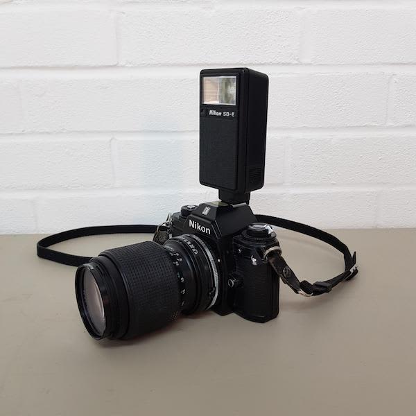 5: Nikon EM Long Lens Paparazzi Camera With Working Flash Unit