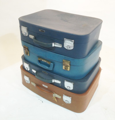 Stack of Different Coloured Retro Soft Leather Suitcases 