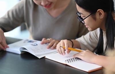 Parent helps child with study
