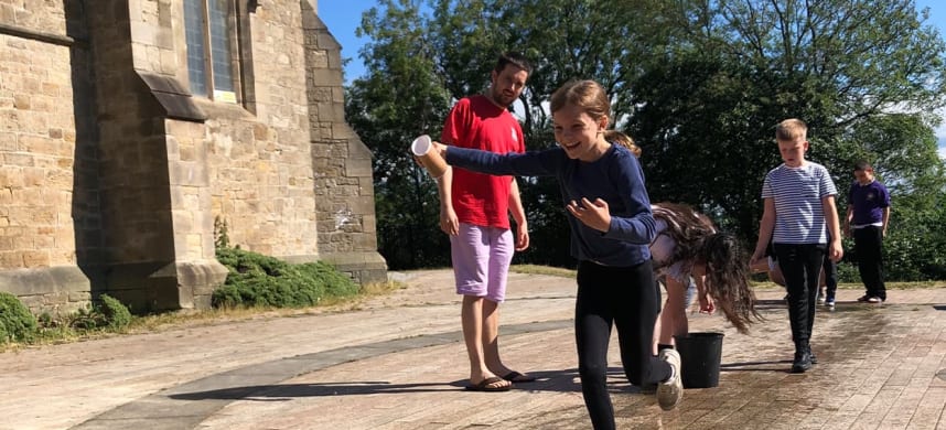 Kids playing outside a church