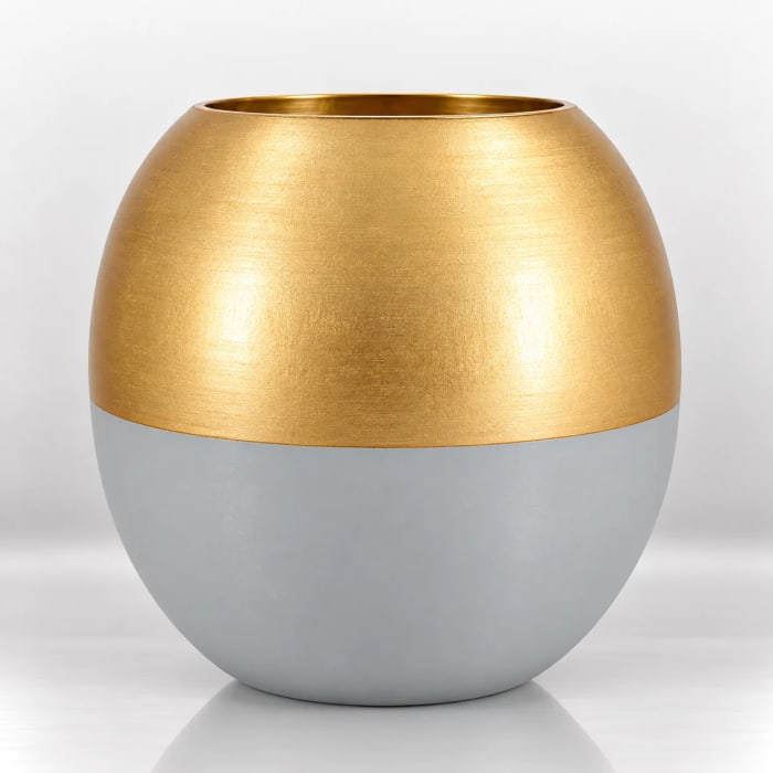 Round two-tone candle holder with a matte ivory lower body and brushed-gold upper finish.
