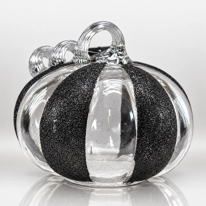 Black and clear glass Halloween pumpkin with glittered sections and looped stem