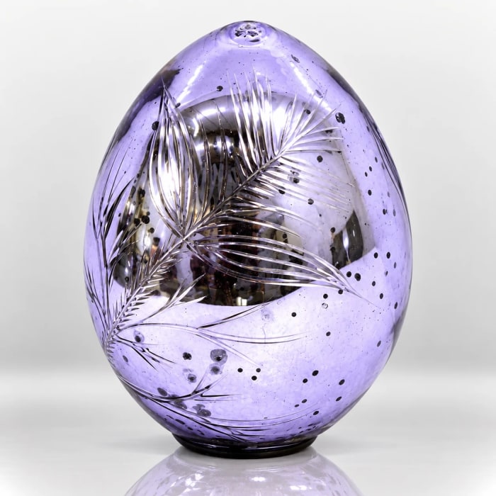 Lavender glass Easter egg with etched leaf pattern, silver detailing and speckled accents.