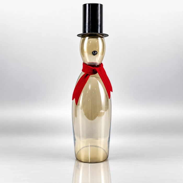 Gold glass snowman with red scarf, black top hat and slender transparent body.