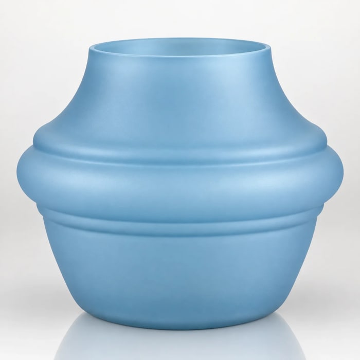 Round sky-blue candle holder with sculpted layered bands and a smooth matte finish.
