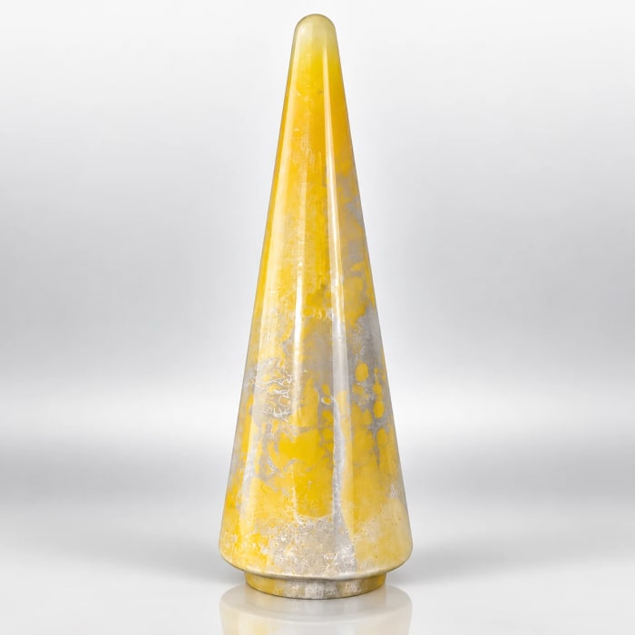 Yellow glass Christmas tree with silver mottled detailing, tapered shape, glossy finish and round base.