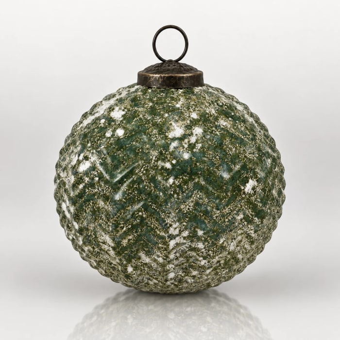 Round green textured glass Christmas bauble with mottled decoration, metal cap and hanging loop.