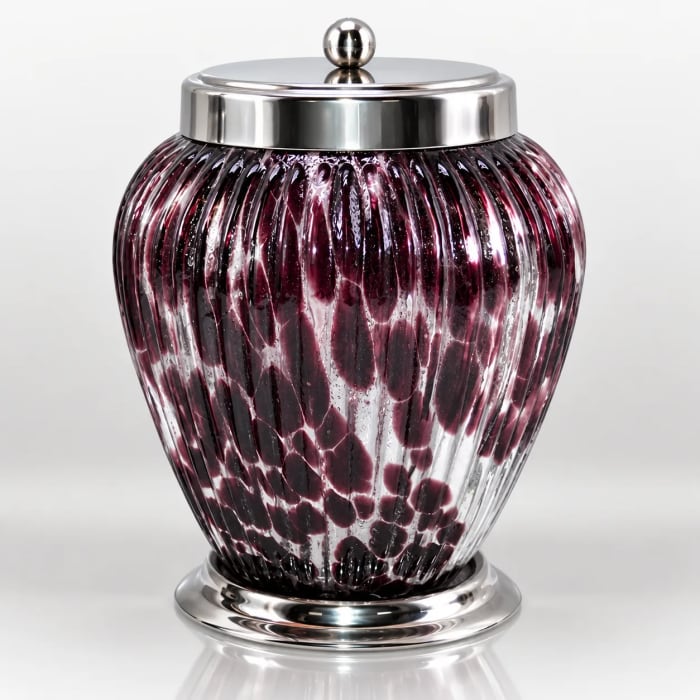 Plum-toned ribbed glass storage jar with silver-tone lid and raised base