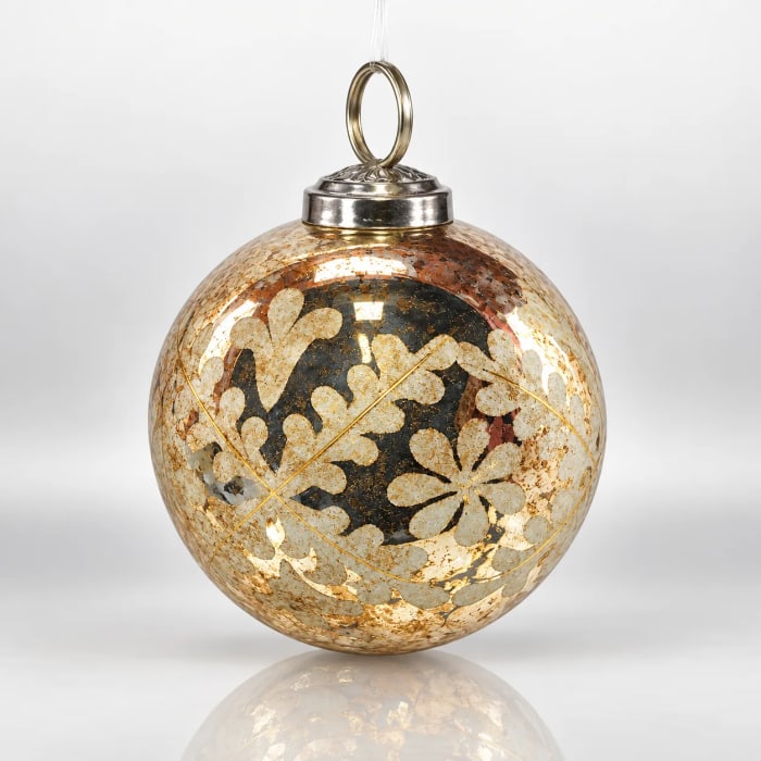 Gold glass Christmas bauble with floral detailing, antique mottled finish, metallic cap and hanging loop.