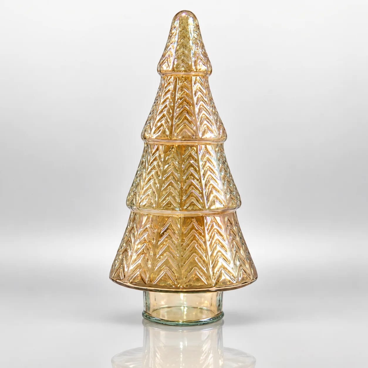 Gold glass Christmas tree with tiered chevron pattern, iridescent finish and transparent round base.