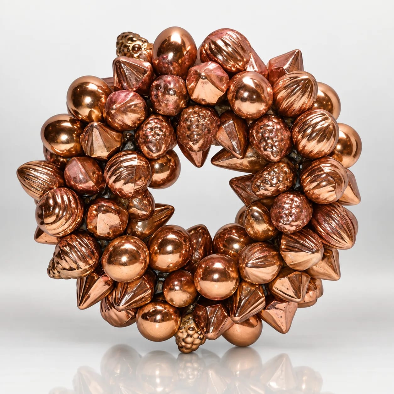 Copper Christmas wreath with clustered spherical, ribbed and faceted ornaments