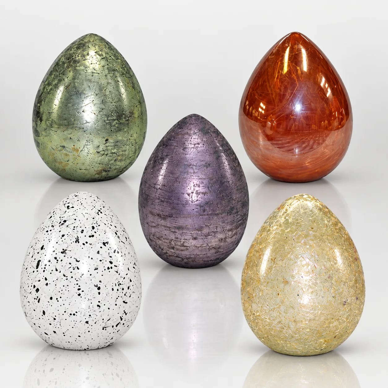 Decorative glass Easter eggs in green, purple, amber, white and gold finishes
