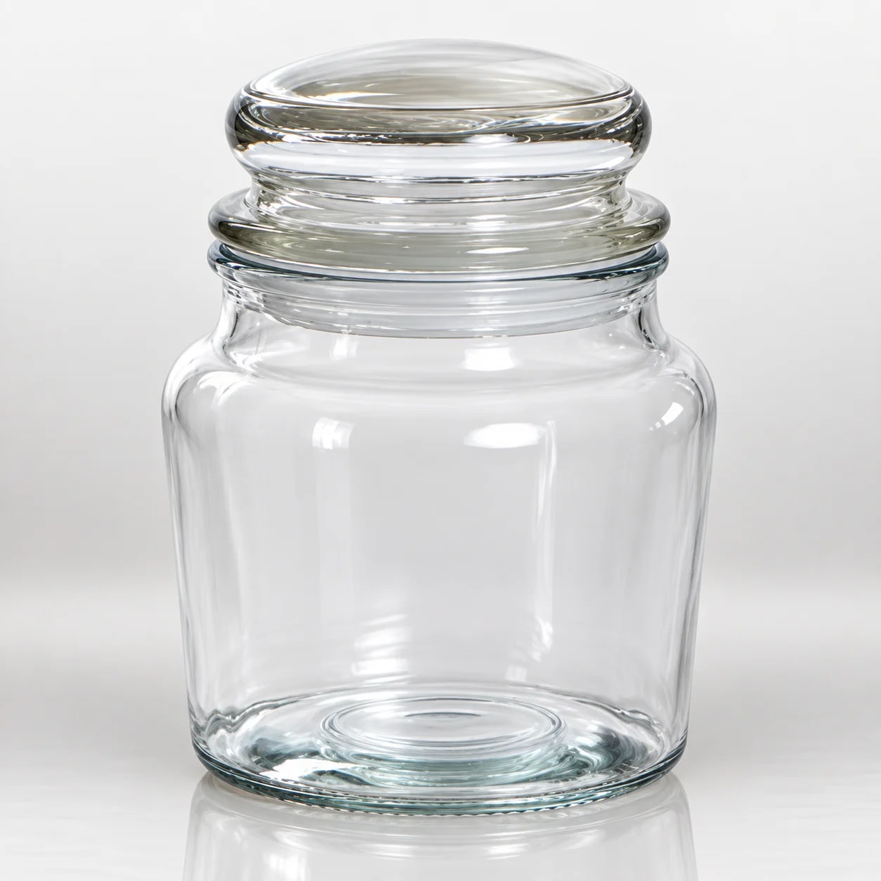Clear glass aromatic candle jar with cylindrical body and stepped rounded rim