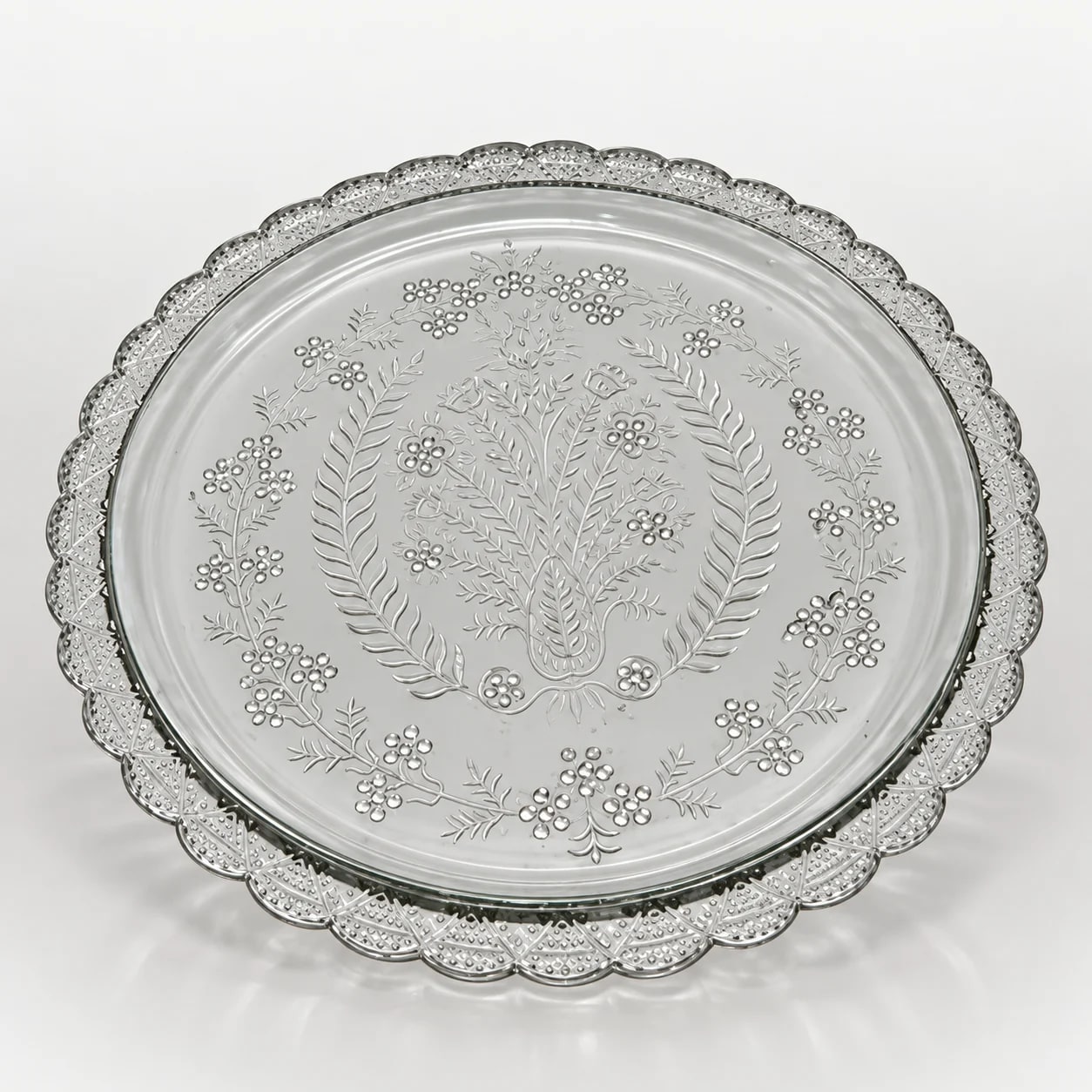 Clear round glass platter with floral etching and scalloped decorative border